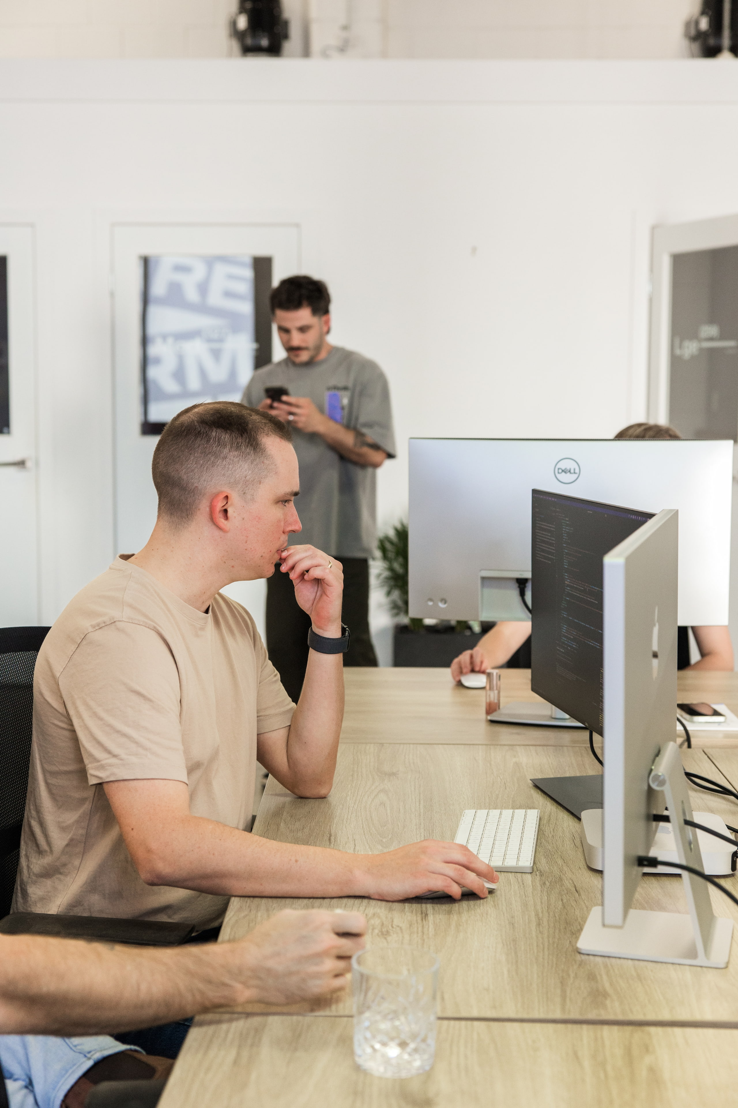 An Embark team member focused at their desk