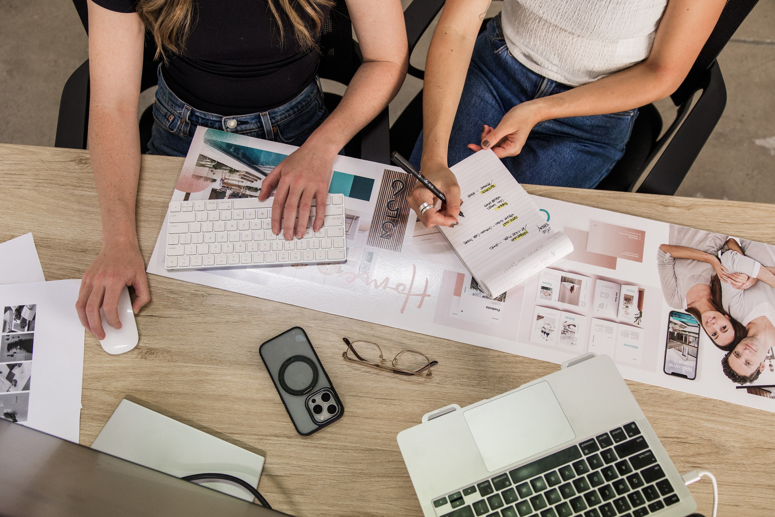 Designs and devices laid out across a studio table